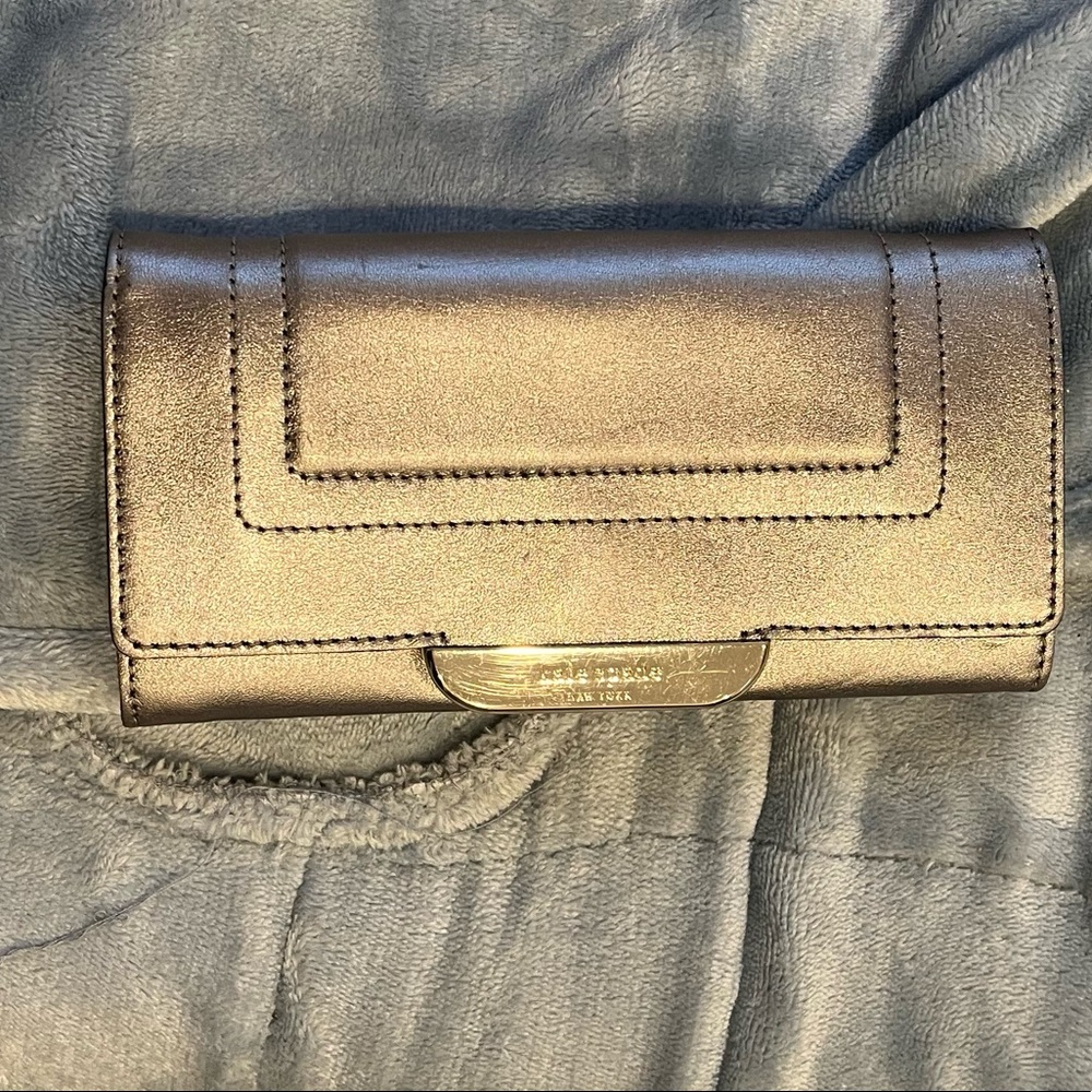 Women’s metallic silver Kate spade wristlet